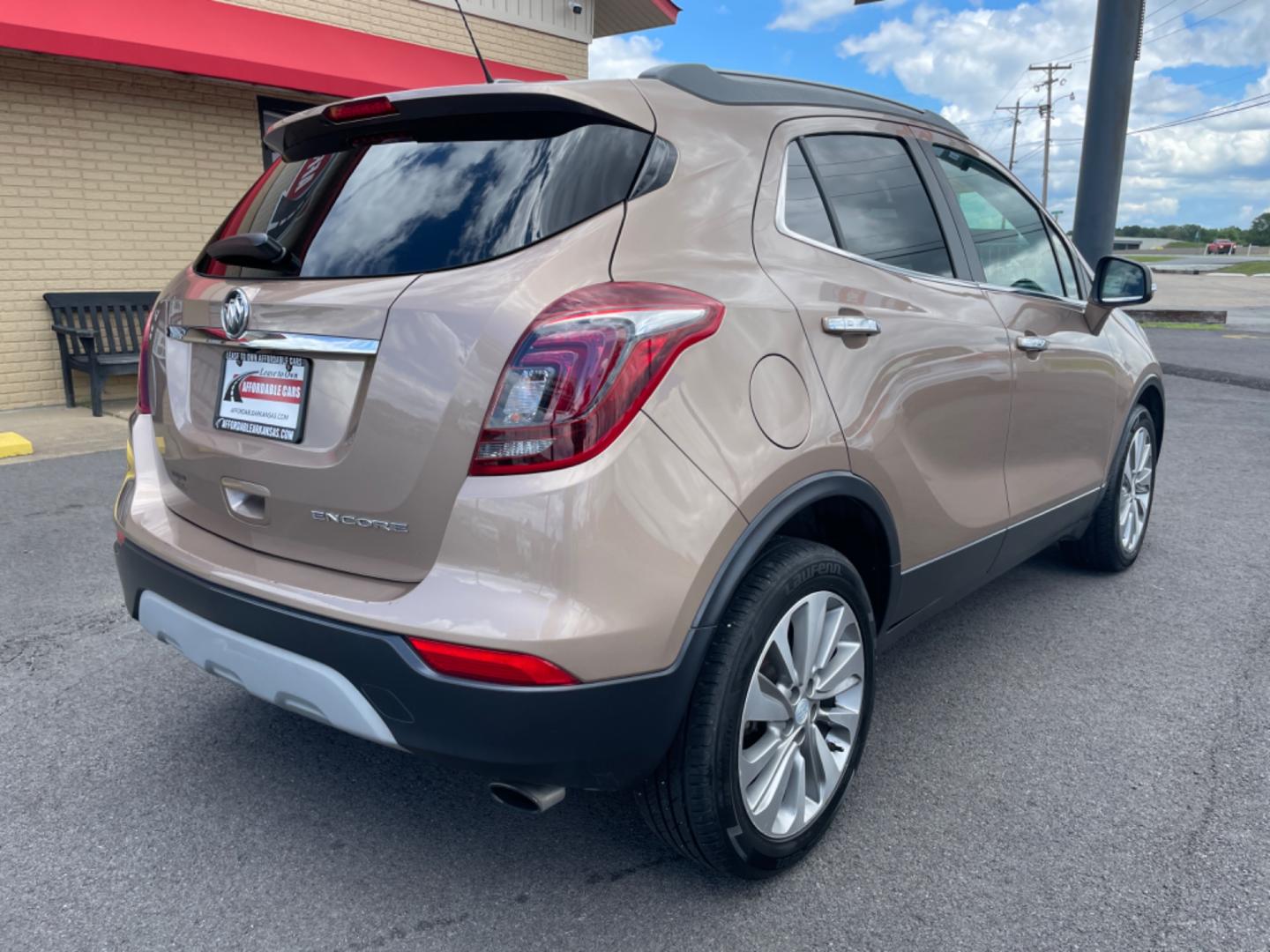 2019 Brown Buick Encore (KL4CJASB6KB) with an 4-Cyl, ECOTEC, Turbo, 1.4 Liter engine, Automatic, 6-Spd w/Overdrive and Shift Control transmission, located at 8008 Warden Rd, Sherwood, AR, 72120, (501) 801-6100, 34.830078, -92.186684 - Photo#7